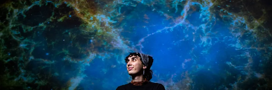 A student looks up to a celestial view 