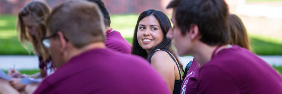 student in a circle looking backwards at someone