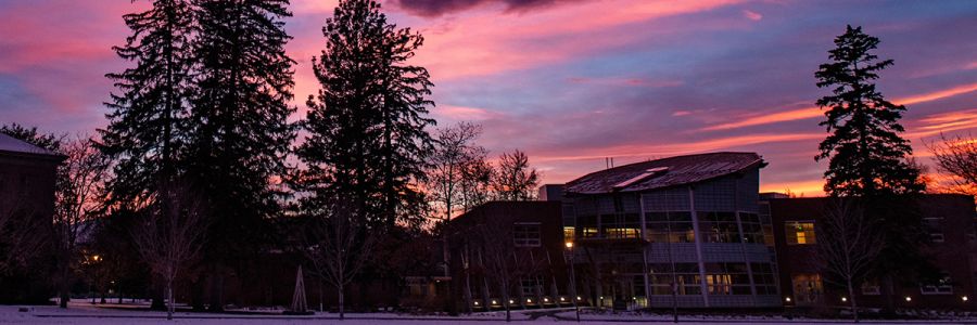 dramatic sky as sun sets over Payne Family Native American Center