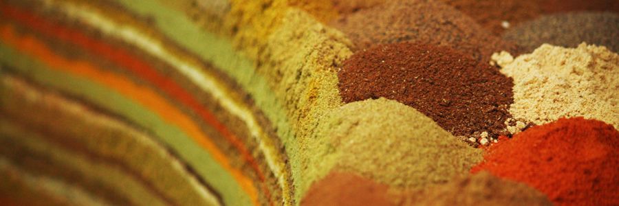 layered pile of differently colored powders with small piles on the right