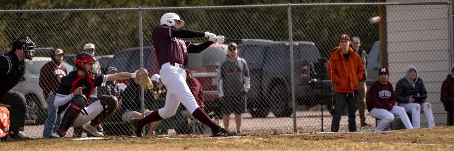 Griz baseball player swings at a pitch