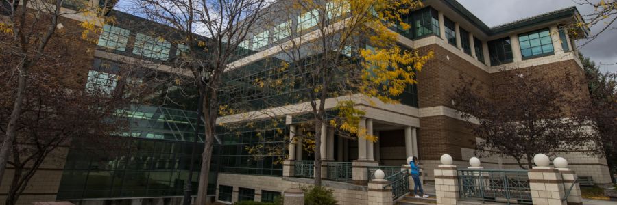 the gallagher business building entrance seen with trees in fall