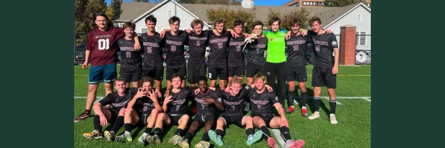 Griz club soccer players pose for a photo 