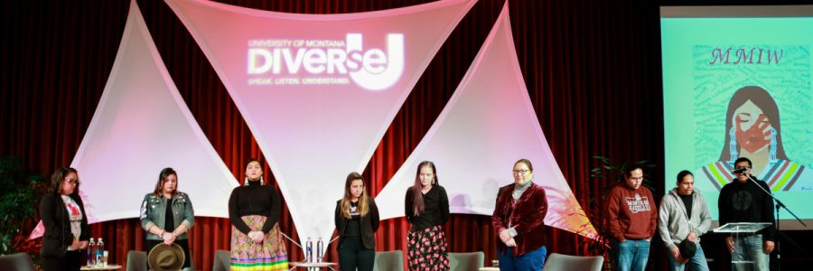 group of speakers on stand in front of a Diverse U banner