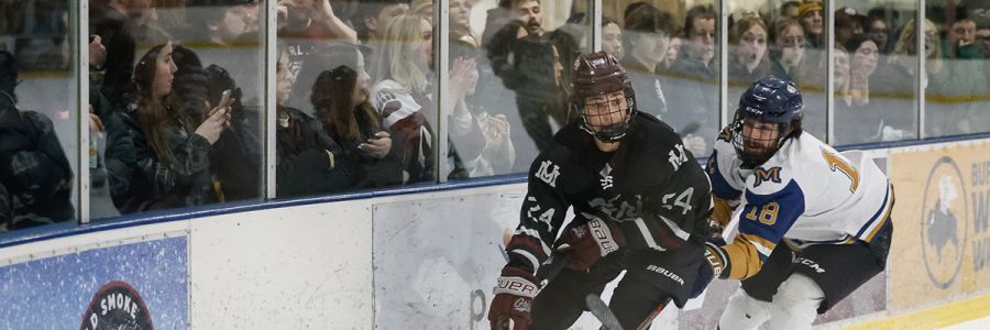 Griz hockey player skates during a game