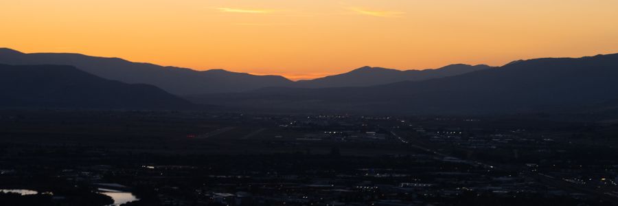 Missoula valley at dusk with an orange sky
