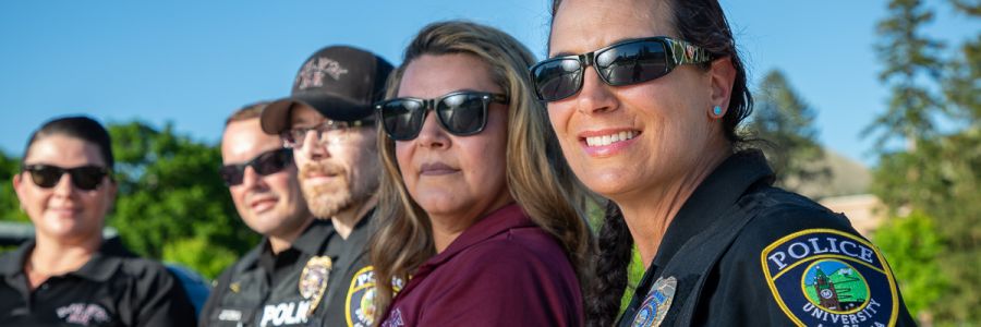 a row of UM police officers smiling for the camera