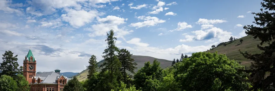 Main Hall tower with Mount Jumbo and Mount Sentinel in the backgroud