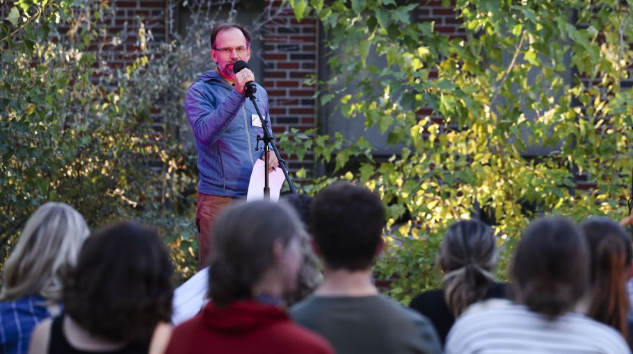 office of sustainability staff stands in front of crowd to introduce sustainability slam