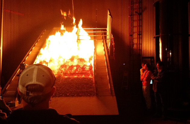 Students look at the burn chamber at the Missoula Fire Lab, a leading federal research facility 