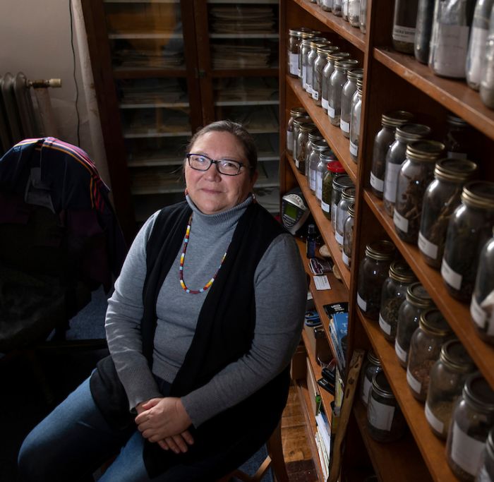 Rosalyn LaPier sitting next to sample bottles