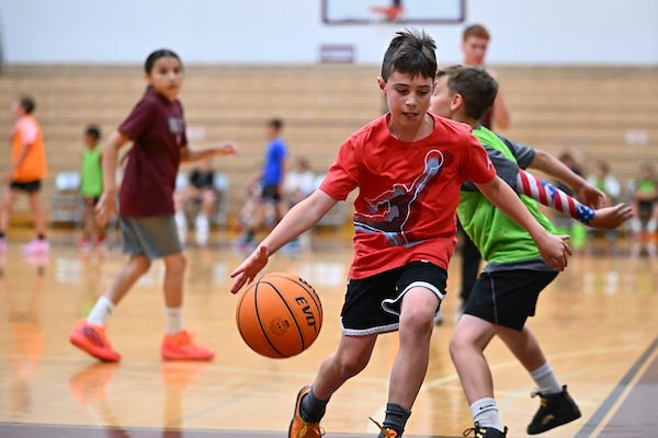 Children participate in a basketball camp at UM