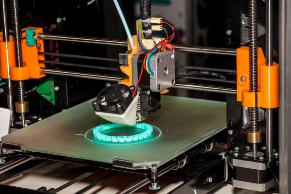 3-d printer printing an object that is circular in shape