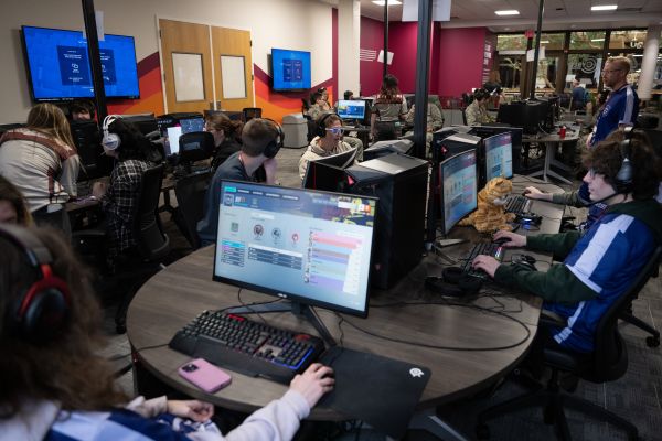 eSports students sit at computers during a competition