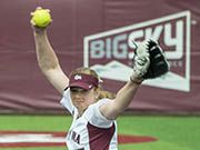 Softball player pitching