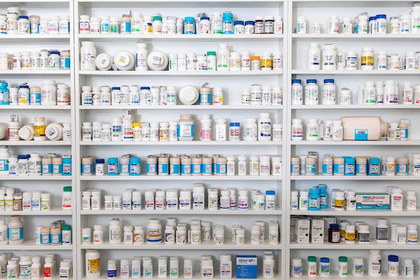 Bottles of medication on shelves.