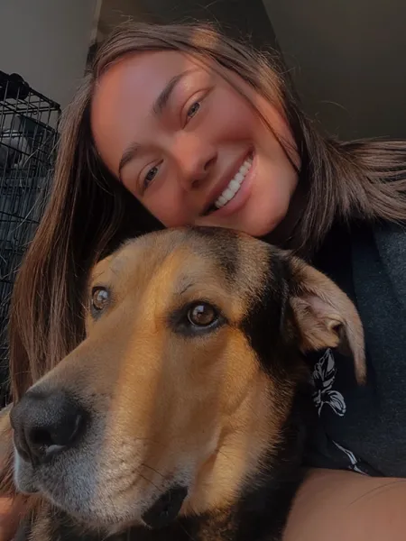 Kennedi headshot with dog Ajax