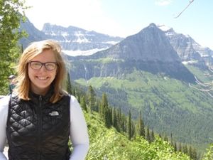 Dr. Olivia Holter standing in front of a mountain range