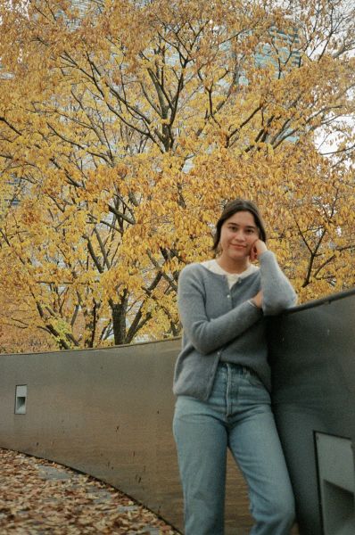 Nancy Lagunas smiling in front of yellow trees in the fall