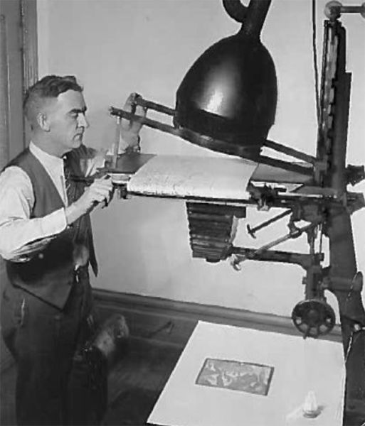 James B. Yule operating an enlarger / projector. 