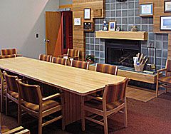 Small conference room with fireplace and oak table