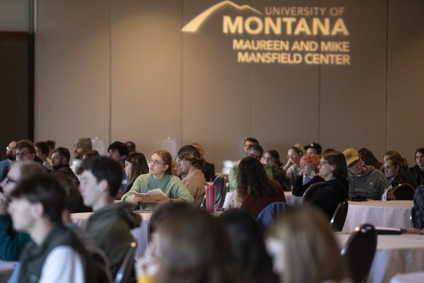 Students sit in the UC Ballroom to listen to a lecture.