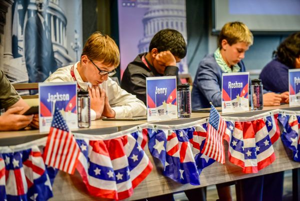A group of Civics Bee participants sitting at a table