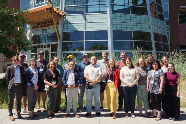 A group of Montana high school social studies teachers standing in front of the Payne Native American Center