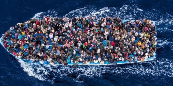 an aerial view of a boat full of people