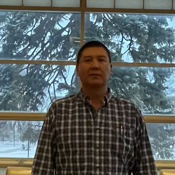 AISS Program Coordinator Virgil posing in the rotunda of the PFNAC 
