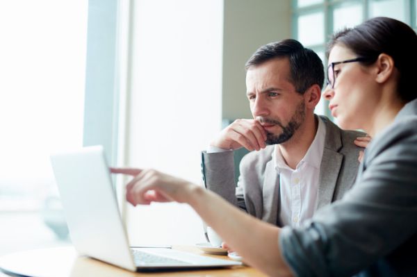 Two business people holding a meeting.