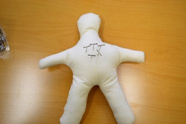 voodoo doll with pins