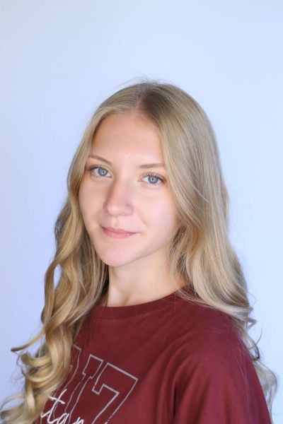 anna dolsen sits for professional headshot