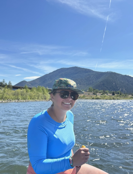 zoe smiling on a raft