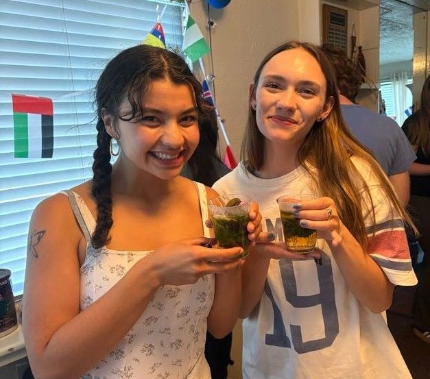 Two girls holding tea cups