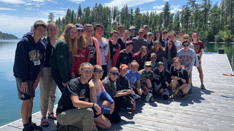 Schwanke participants posing for group photo on  a dock on Flathead Lake