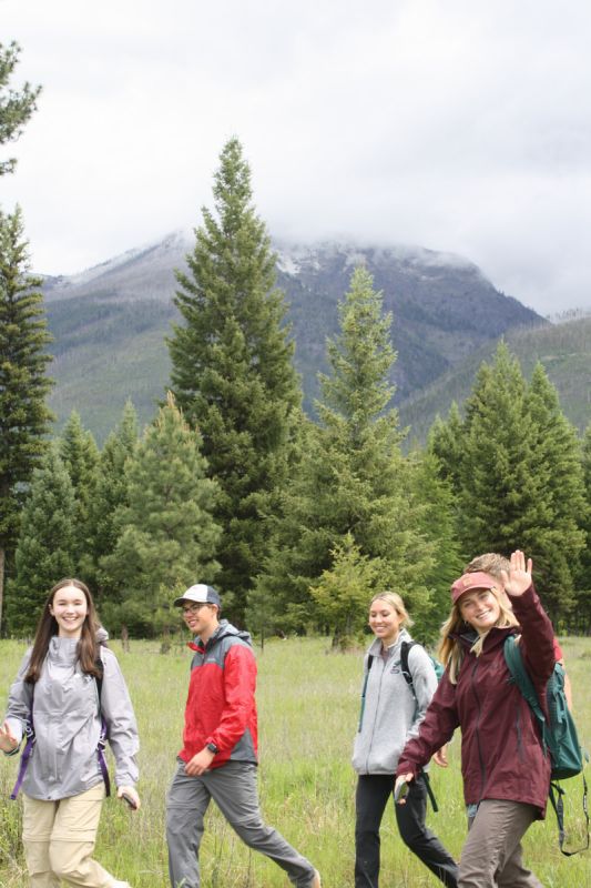 Schwanke participants waving while hiking