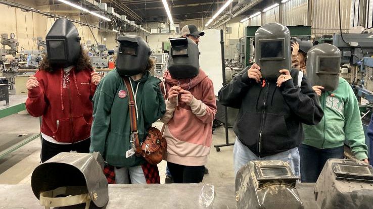 Middle school students in welding face shields at Missoula College 