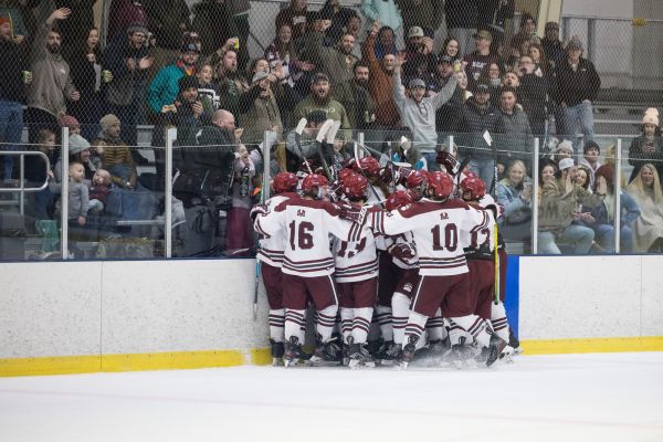 Griz Hockey Team Celebrating in Front of Home Crowd