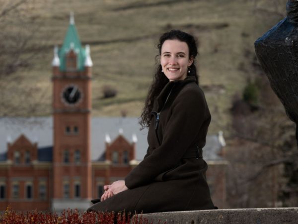 Lydia Garrick, a junior 91Ƶ studying biochemistry, poses for a photo with Main Hall in the background