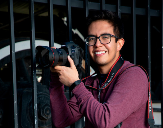 Student with camera ready to take a picture. 