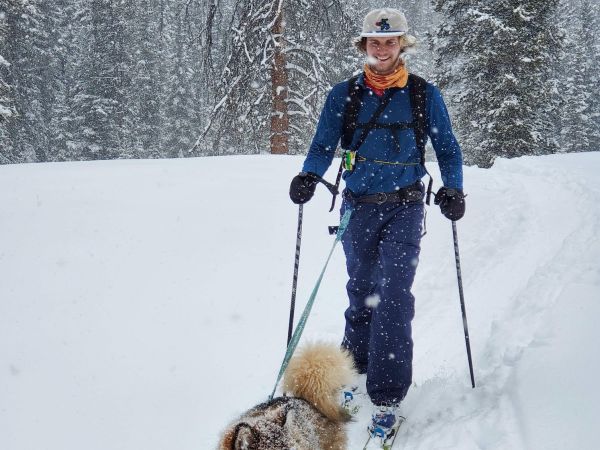 Student Success Coordinator, Andy Josten, cross country skiing with his dog