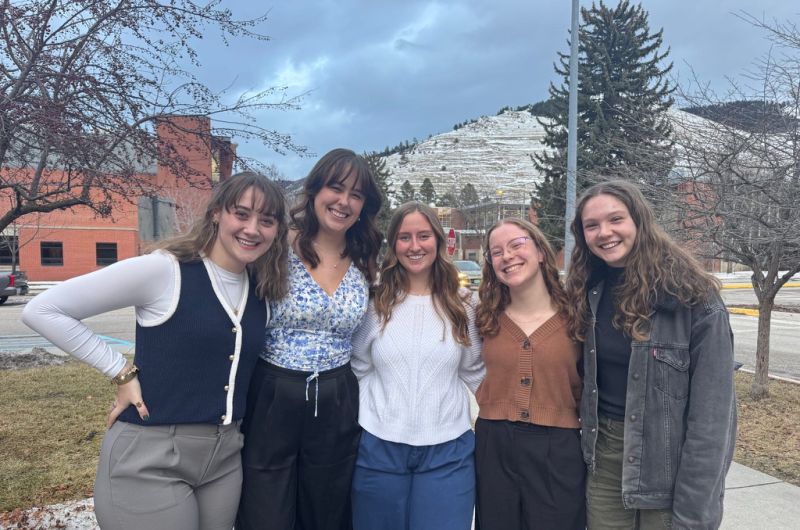 five students posing