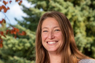 Image of Leah smiling, she's your outdoor adventure admissions counselor