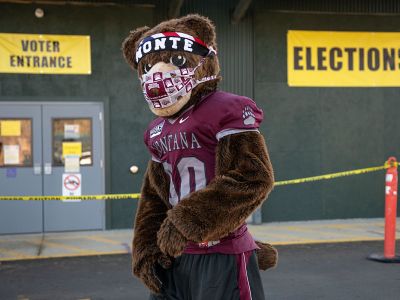 Monte the mascot stands outside a Missoula polling place.
