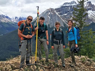 “Ghost Forests” producer Breanna McCabe (far right) stops to smile alongside Parks Canada whitebark pine specialists Laura Kroesen, Megan Kinley and Roslyn Johnson on Paget Peak.