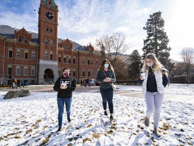 Photo of students walking across campus