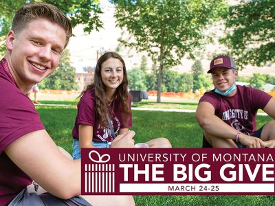 Students smile on the grass at UM for an ad that says The Big Give, March 24-25.
