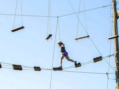 Student balancing on a high rope