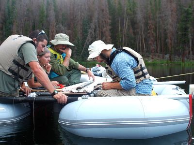 Philip Higuera, UM professor of fire ecology, and his team examine a lake-sediment core from Chickaree Lake in Colorado’s Rocky Mountain National Park. 